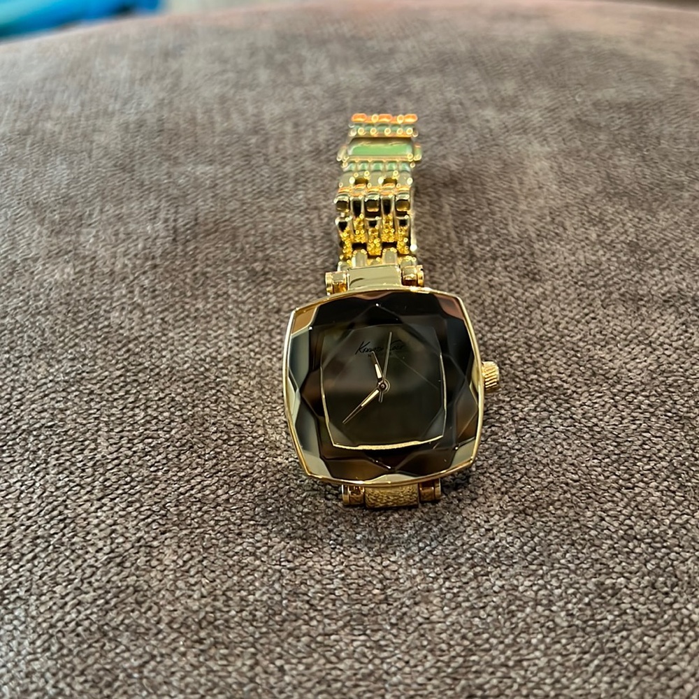 Gorgeous gold Kenneth Cole bangle watch.